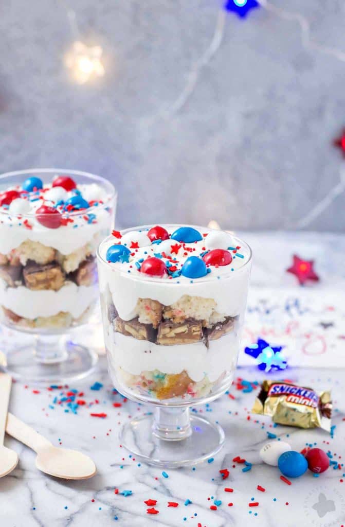 Layers of Pillsbury™ Funfetti® Cake, Frosting, Snickers and M&M’s make these Patriotic Mini Trifles the best way to spread your love of Red, White and Blue! | Strawberry Blondie Kitchen