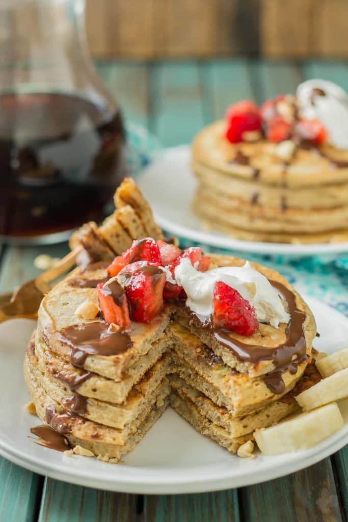 Now you can have an ice cream sundae for breakfast.  Banana Split Pancakes have all the flavors you love of the classic ice cream treat, in breakfast form! | Strawberry Blondie Kitchen