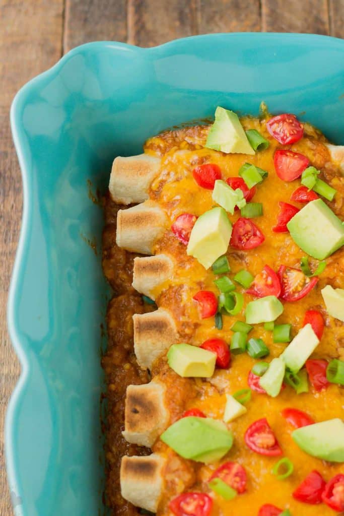 Chipotle Chicken Enchiladas are tasty, filling and come together in a snap thanks to rotisserie chicken and Pop & Cook. Perfect for an easy weeknight meal that is sure to please the whole family! | Strawberry Blondie Kitchen