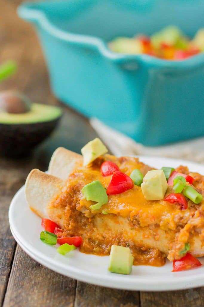 Chipotle Chicken Enchiladas are tasty, filling and come together in a snap thanks to rotisserie chicken and Pop & Cook. Perfect for an easy weeknight meal that is sure to please the whole family! | Strawberry Blondie Kitchen