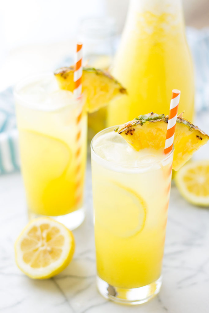 Pineapple pairs with spicy ginger and tart lemonade in sweet harmony to create this Pineapple Ginger Lemonade that is worthy of your next summertime sipper! | Strawberry Blondie Kitchen