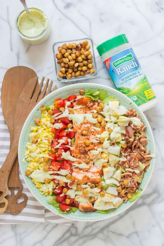 BBQ salmon cobb salad with Avocado Ranch Dressing is bursting with flavors to savor summer! Topped with a delicious crunch from ranch flavored chickpeas it's sure to be your next favorite salad! | Strawberry Blondie Kitchen