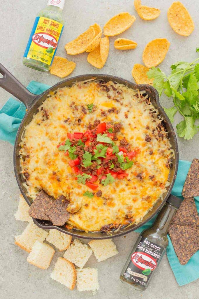 Chorizo Queso Fundido is a delicious and flavorful dip filled with cheeses, chorizo, tequila and El Yucateco® hot sauce.  It's the perfect appetizer for game day and everything in between! | Strawberry Blondie Kitchen