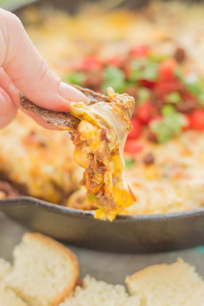 Chorizo Queso Fundido is a delicious and flavorful dip filled with cheeses, chorizo, tequila and El Yucateco® hot sauce.  It's the perfect appetizer for game day and everything in between! | Strawberry Blondie Kitchen