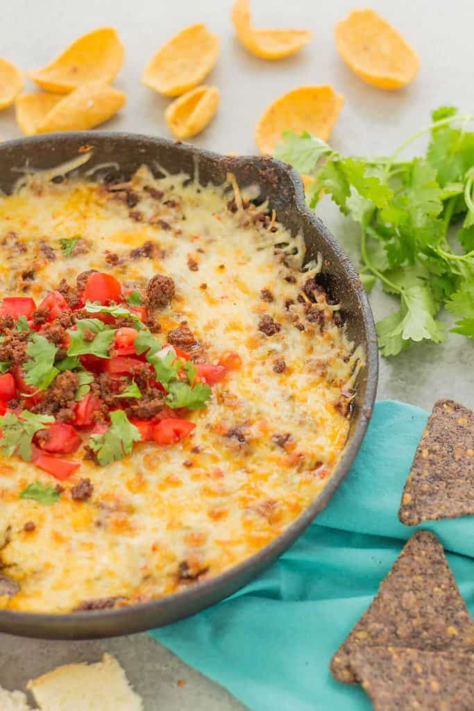 Chorizo Queso Fundido is a delicious and flavorful dip filled with cheeses, chorizo, tequila and El Yucateco® hot sauce.  It's the perfect appetizer for game day and everything in between! | Strawberry Blondie Kitchen