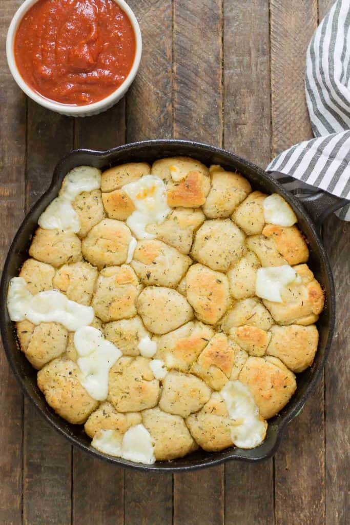 Savory bites of gooey cheese and garlic, these Garlic Cheese Bombs will be your new go to appetizer, snack or side dish for any occasion!  | Strawberry Blondie Kitchen