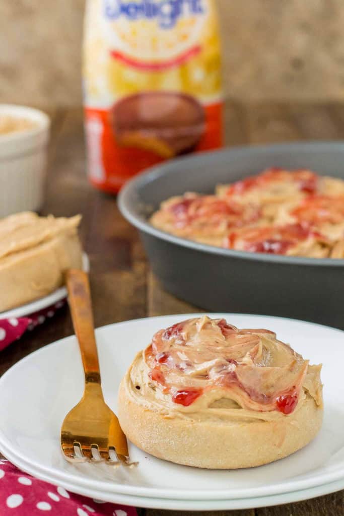 These Peanut Butter and Jelly Breakfast rolls are breakfast bliss.  Peanut butter flavored rolls, stuffed with jelly and topped with a peanut butter frosting are the best breakfast rolls yet! | Strawberry Blondie Kitchen