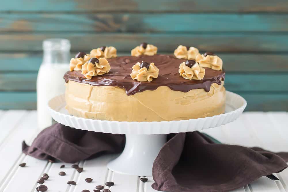 Rich chocolate espresso cakes are layered with Pillsbury™ Peanut Butter Frosting made with real Jif® Peanut Butter to create this Peanut Butter Espresso Cake which is the ultimate cake lover’s dream! | Strawberry Blondie Kitchen