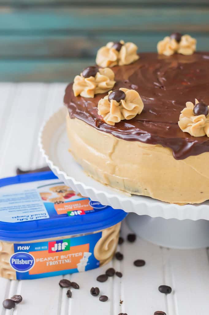 Rich chocolate espresso cakes are layered with Pillsbury™ Peanut Butter Frosting made with real Jif® Peanut Butter to create this Peanut Butter Espresso Cake which is the ultimate cake lover’s dream! | Strawberry Blondie Kitchen