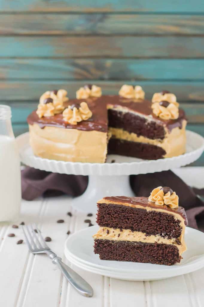 Rich chocolate espresso cakes are layered with Pillsbury™ Peanut Butter Frosting made with real Jif® Peanut Butter to create this Peanut Butter Espresso Cake which is the ultimate cake lover’s dream! | Strawberry Blondie Kitchen
