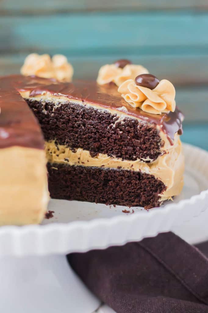 Rich chocolate espresso cakes are layered with Pillsbury™ Peanut Butter Frosting made with real Jif® Peanut Butter to create this Peanut Butter Espresso Cake which is the ultimate cake lover’s dream! | Strawberry Blondie Kitchen