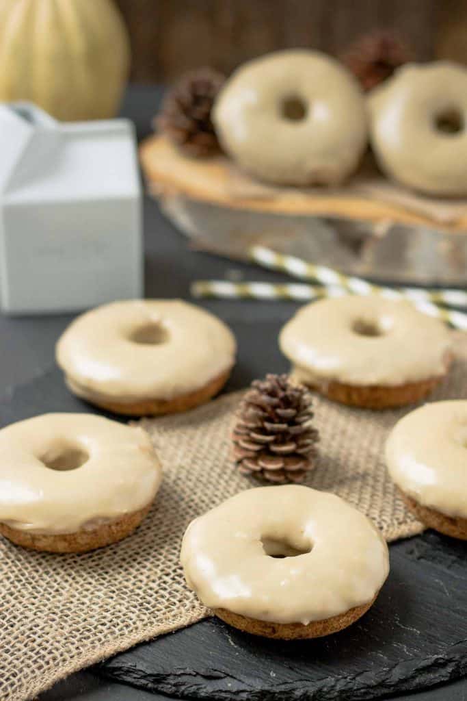 These Apple Cider Donuts with Maple Frosting are perfect on a crisp fall morning with a hot cup of coffee.  They're moist, delicious and bursting with apple and maple flavors. | Strawberry Blondie Kitchen