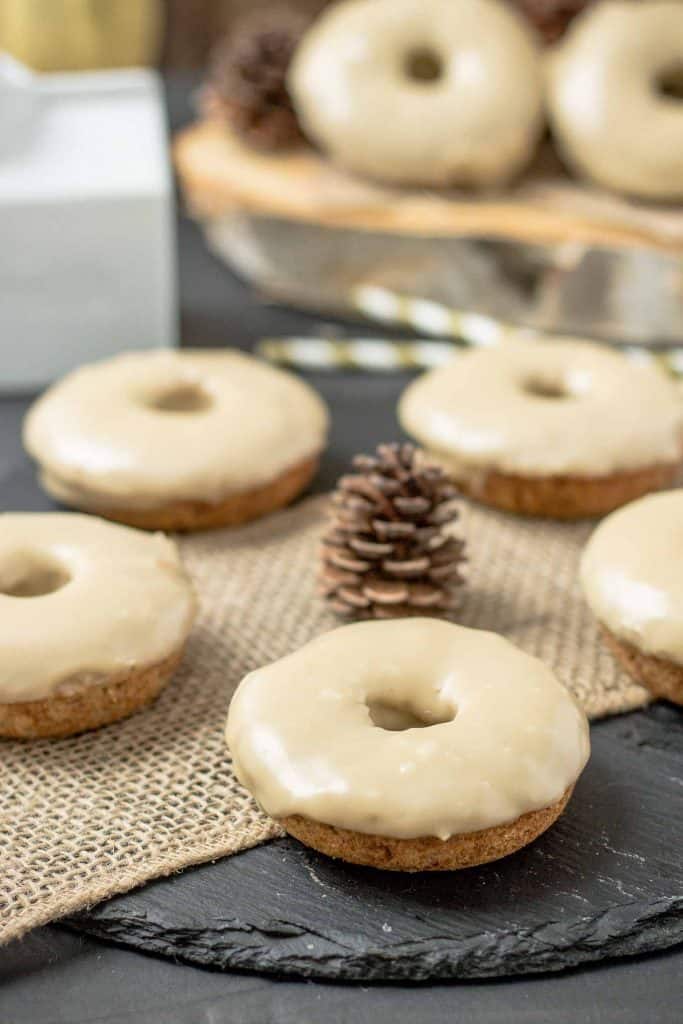 These Apple Cider Donuts with Maple Frosting are perfect on a crisp fall morning with a hot cup of coffee.  They're moist, delicious and bursting with apple and maple flavors. | Strawberry Blondie Kitchen