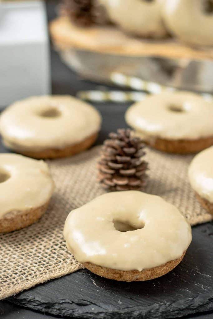 These Apple Cider Donuts with Maple Frosting are perfect on a crisp fall morning with a hot cup of coffee.  They're moist, delicious and bursting with apple and maple flavors. | Strawberry Blondie Kitchen