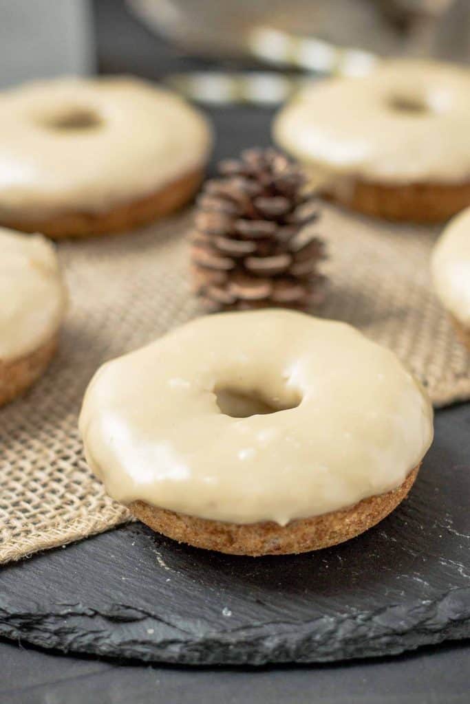 These Apple Cider Donuts with Maple Frosting are perfect on a crisp fall morning with a hot cup of coffee.  They're moist, delicious and bursting with apple and maple flavors. | Strawberry Blondie Kitchen