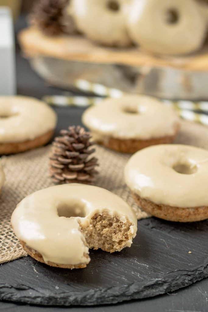 These Apple Cider Donuts with Maple Frosting are perfect on a crisp fall morning with a hot cup of coffee.  They're moist, delicious and bursting with apple and maple flavors. | Strawberry Blondie Kitchen