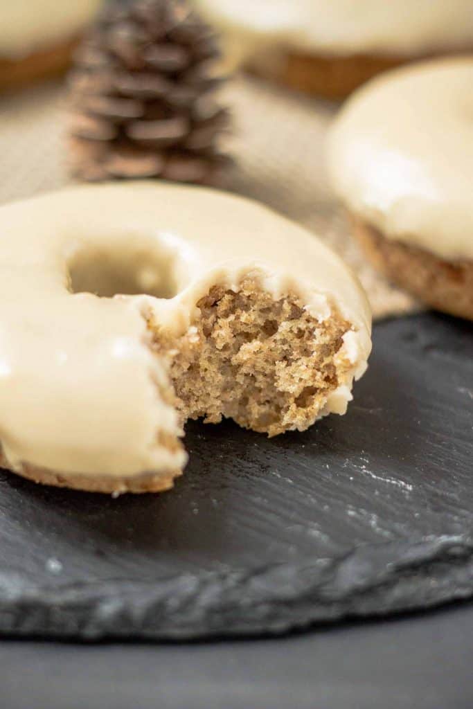 These Apple Cider Donuts with Maple Frosting are perfect on a crisp fall morning with a hot cup of coffee.  They're moist, delicious and bursting with apple and maple flavors. | Strawberry Blondie Kitchen