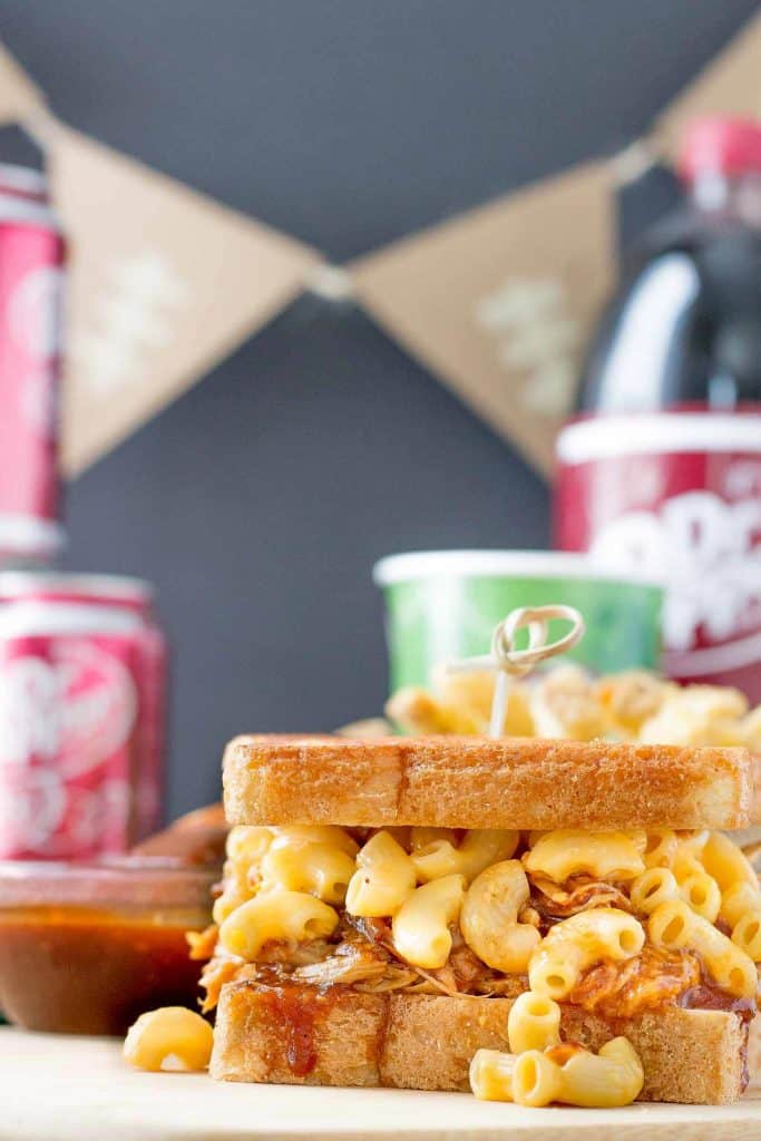 These Dr Pepper Pulled Pork n Mac Sandwiches are a combination of sweet, sharp and tangy. They’re amazing for to feed a crowd on game day, just bring extra napkins.  | Strawberry Blondie Kitchen