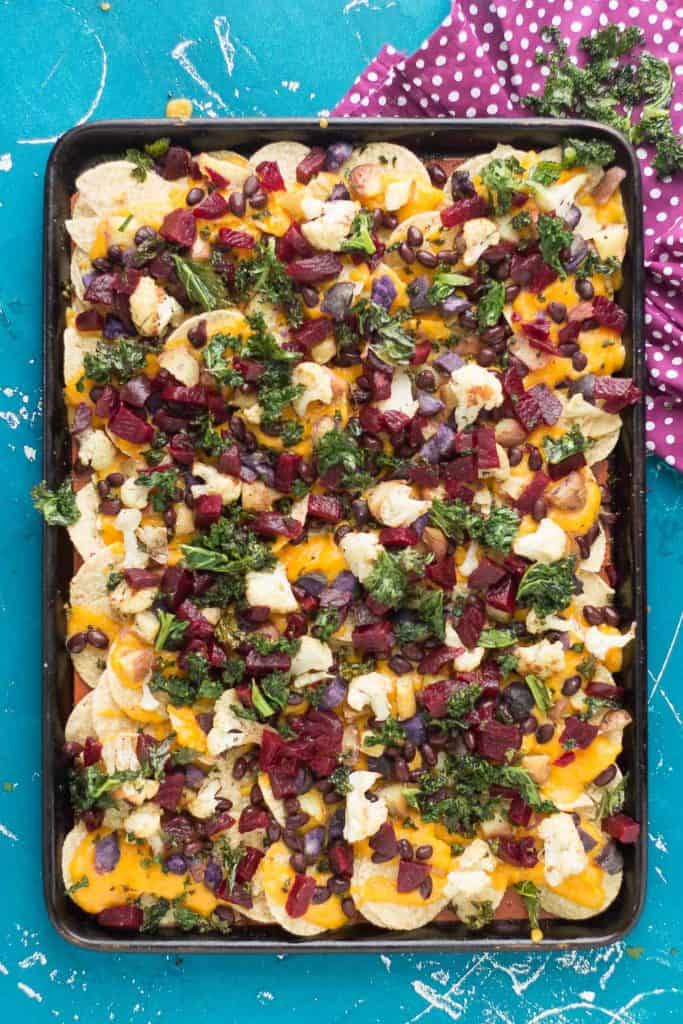 Fall Bounty Sheet Pan Nachos have butternut squash nacho cheese sauce, black beans, kale, roasted cauliflower and beets to give you the ultimate in snacking with all of Fall's delicious produce! | Strawberry Blondie Kitchen
