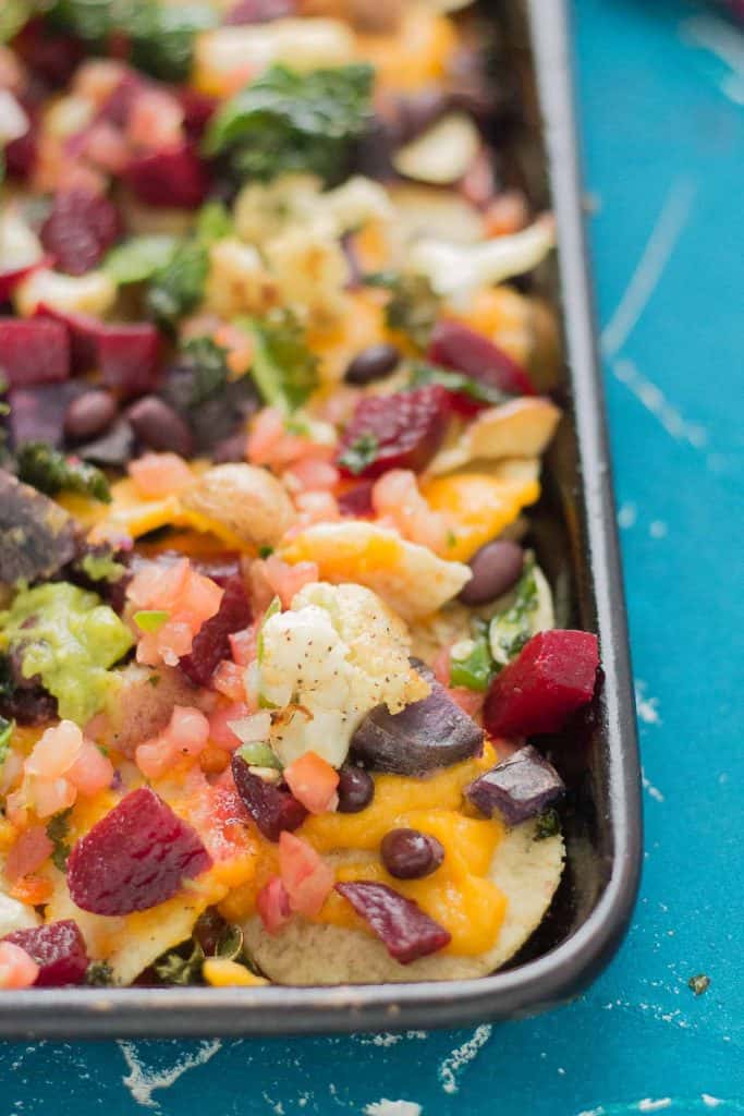 Fall Bounty Sheet Pan Nachos have butternut squash nacho cheese sauce, black beans, kale, roasted cauliflower and beets to give you the ultimate in snacking with all of Fall's delicious produce! | Strawberry Blondie Kitchen