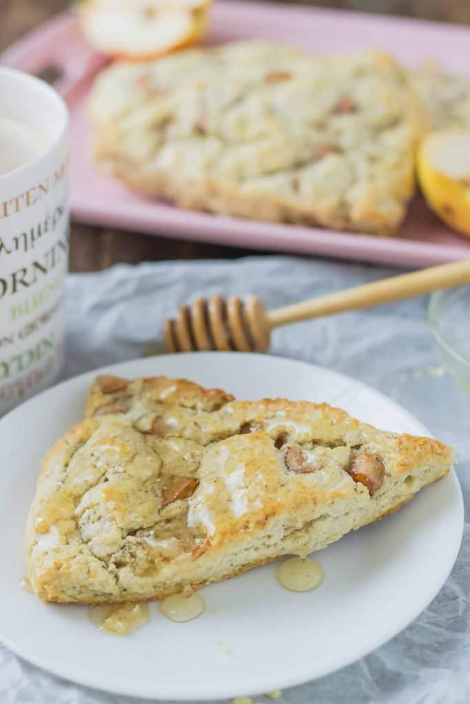 Soft and sweet, with pillows of pear and rich blue cheese and a drizzle of honey, these Pear and Blue Cheese Scones are the perfect pair with your morning cup of coffee! | Strawberry Blondie Kitchen