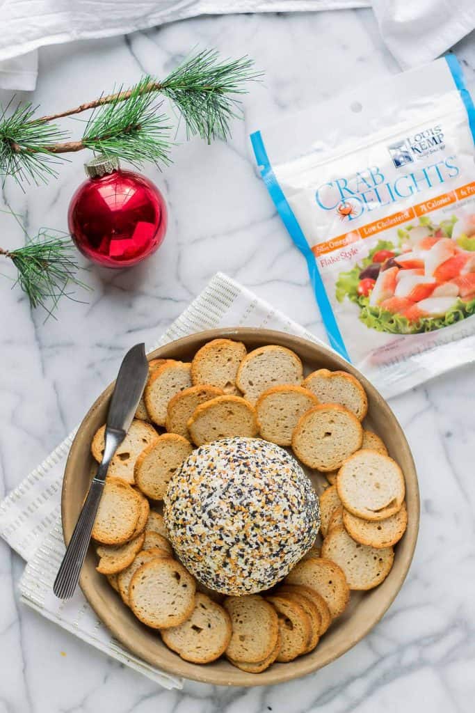 This Crab and Everything Bagel Cheese Ball is packed with crab, fresh herbs and rolled in everything bagel seasoning.  An appetizer worthy of your next get together! | Strawberry Blondie Kitchen