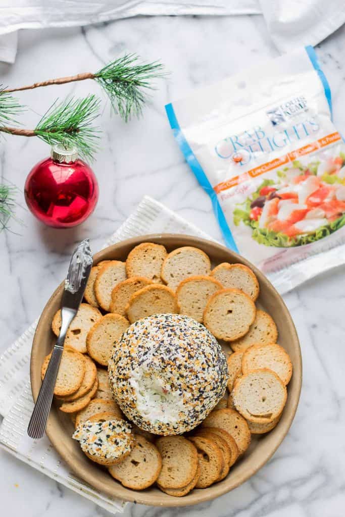 This Crab and Everything Bagel Cheese Ball is packed with crab, fresh herbs and rolled in everything bagel seasoning.  An appetizer worthy of your next get together! | Strawberry Blondie Kitchen