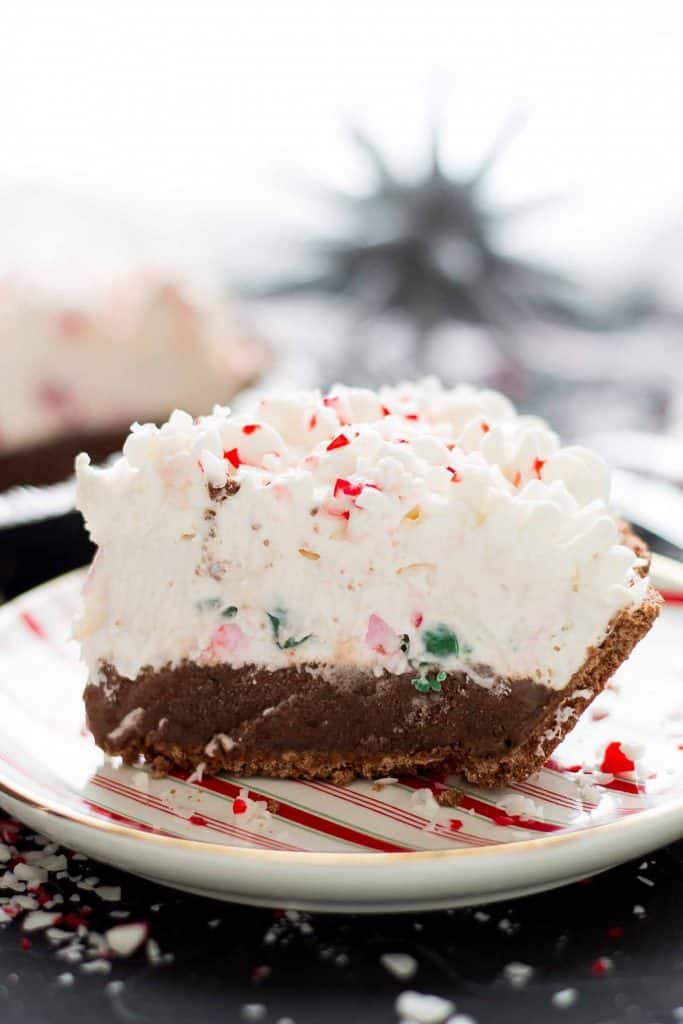 Close up side shot of a slice of no bake candy cane pie with all the layers showing