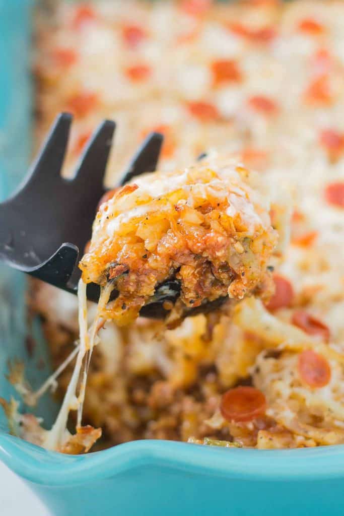 An awesome twist on a classic, this Pizza Shepherd's Pie combines sausage, pepperoni, cheese and hash brown potatoes to give you a hearty casserole worth devouring. | Strawberry Blondie Kitchen