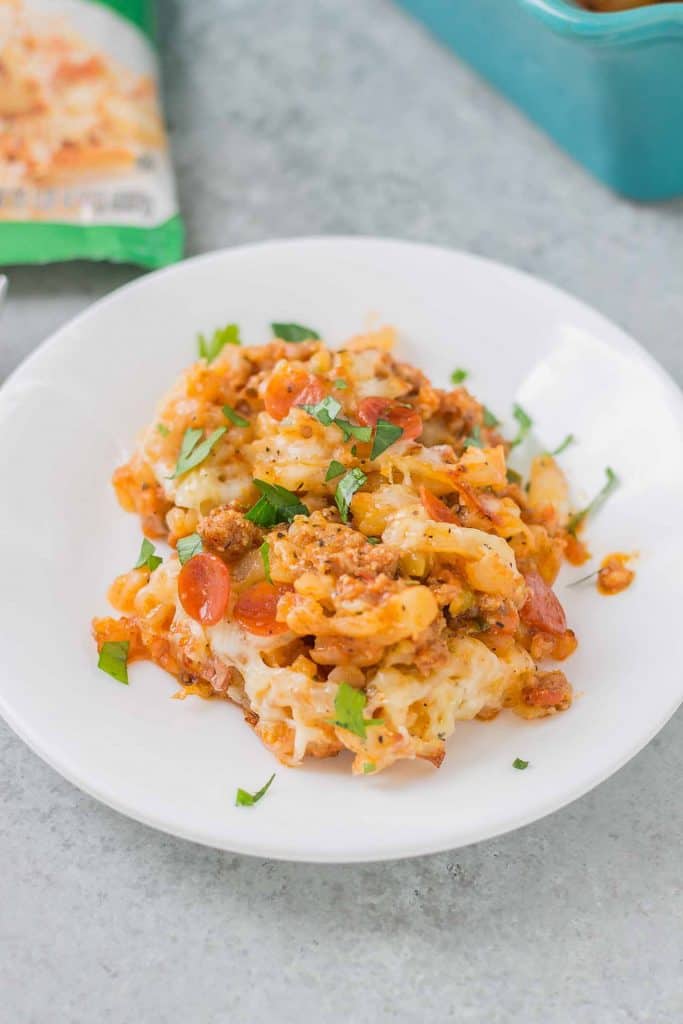 An awesome twist on a classic, this Pizza Shepherd's Pie combines sausage, pepperoni, cheese and hash brown potatoes to give you a hearty casserole worth devouring. | Strawberry Blondie Kitchen