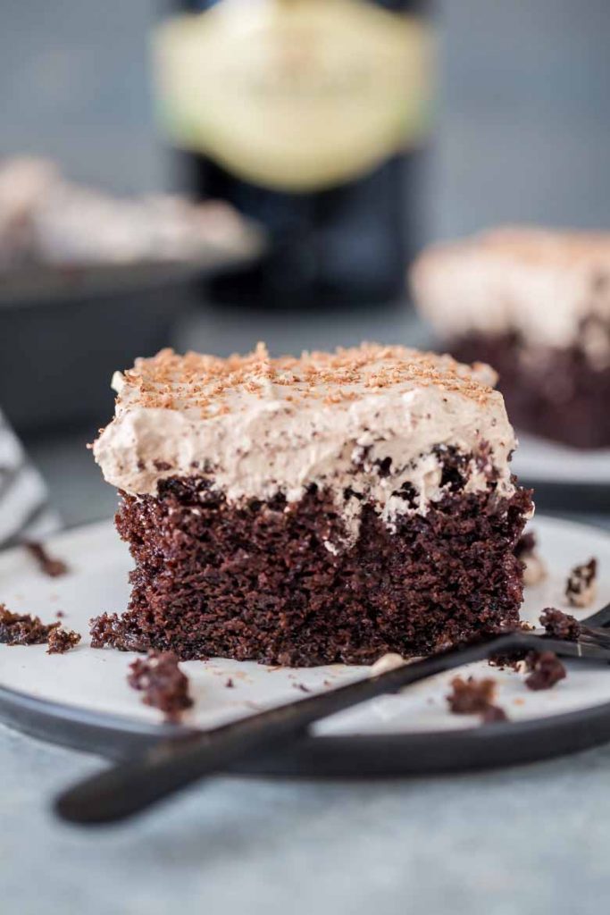 close up of thick slice of Irish Cream Poke Cake