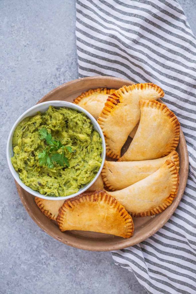 Plate full of baked beef empanadas