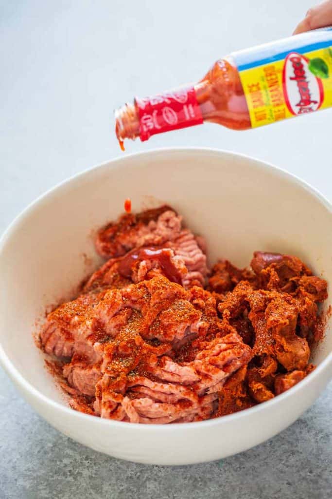 Ground chicken, chorizo, spices and hot sauce for chorizo patty recipe