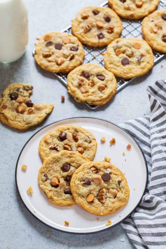 Chewy Seven Layer Cookies are stuffed full of chocolate and butterscotch chips, coconut and pecans.  They're super chewy and soft using a secret ingredient to make them the BEST cookie recipe!