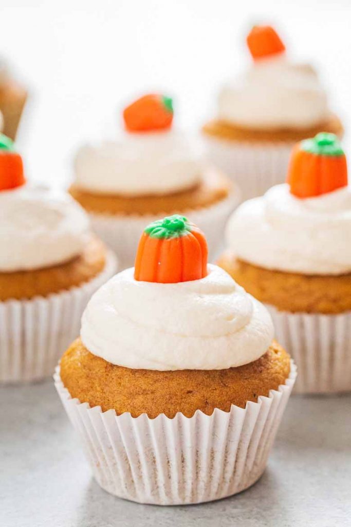 These Pumpkin Cupcakes with Marshmallow Frosting are super soft, moist and topped with a delicious and fluffy marshmallow cream cheese frosting!  You'll love every bite. 