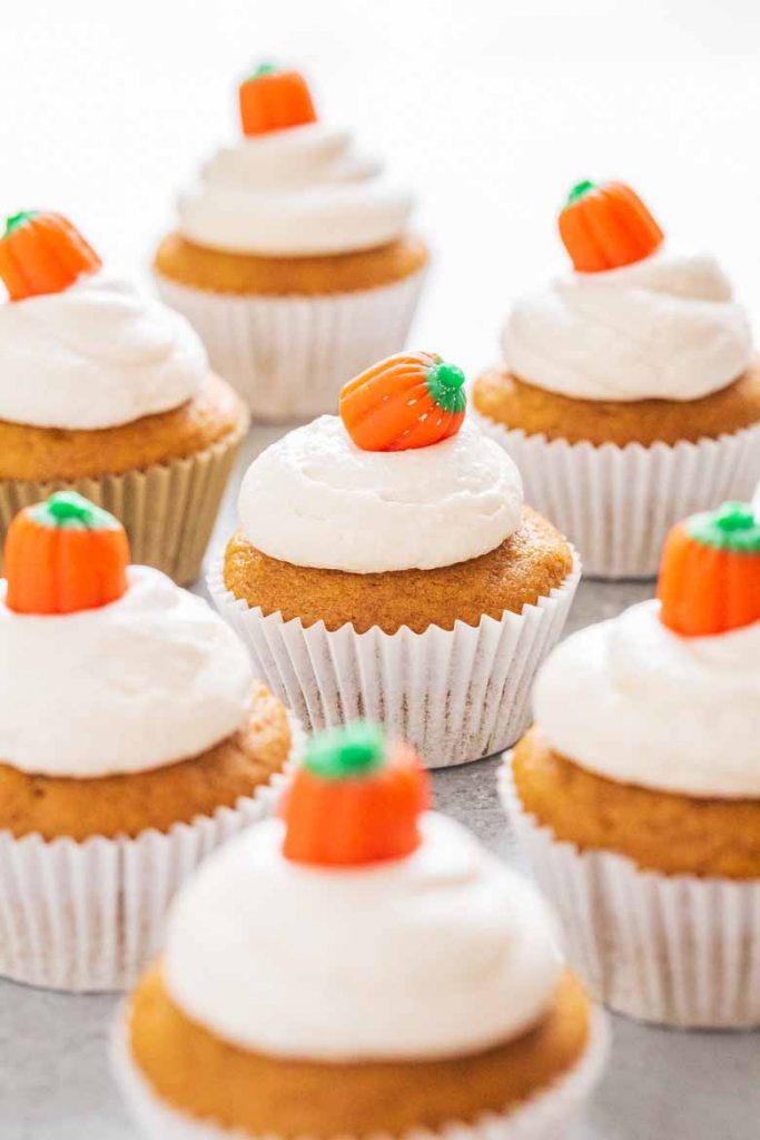 These Pumpkin Cupcakes with Marshmallow Frosting are super soft, moist and topped with a delicious and fluffy marshmallow cream cheese frosting!  You'll love every bite. 