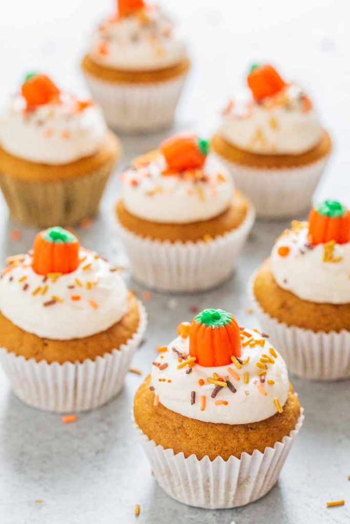 These Pumpkin Cupcakes with Marshmallow Frosting are super soft, moist and topped with a delicious and fluffy marshmallow cream cheese frosting!  You'll love every bite. 