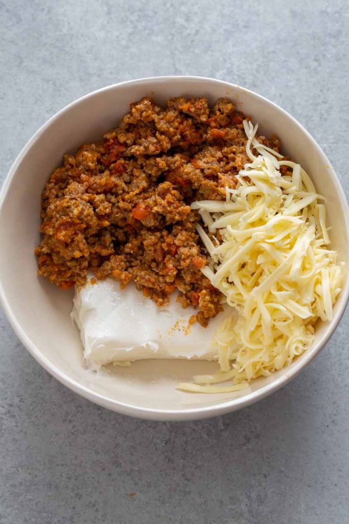 Ingredients in a bowl for Pumpkin Sausage Cheese Balls