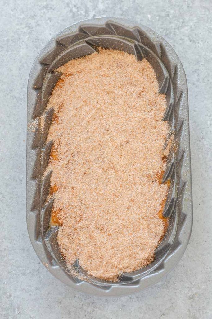 Snickerdoodle Pumpkin Bread Batter sprinkled with cinnamon sugar