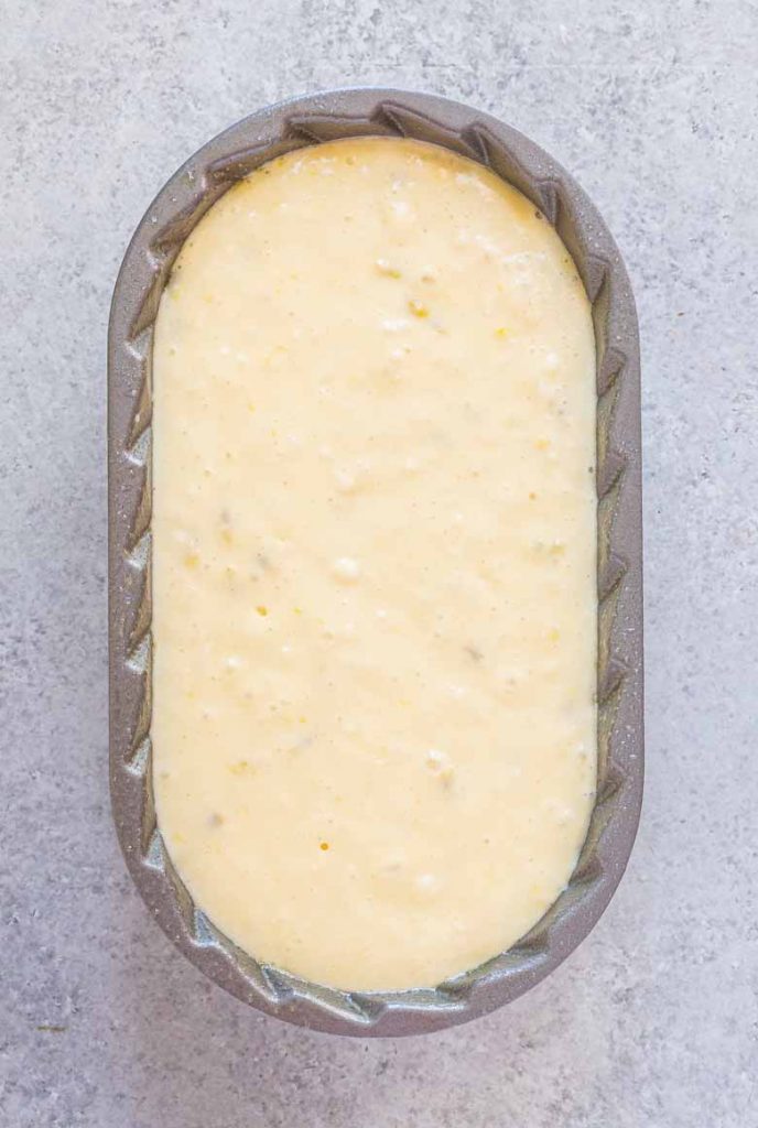 Passion Fruit Coconut Loaf Cake batter in loaf pan