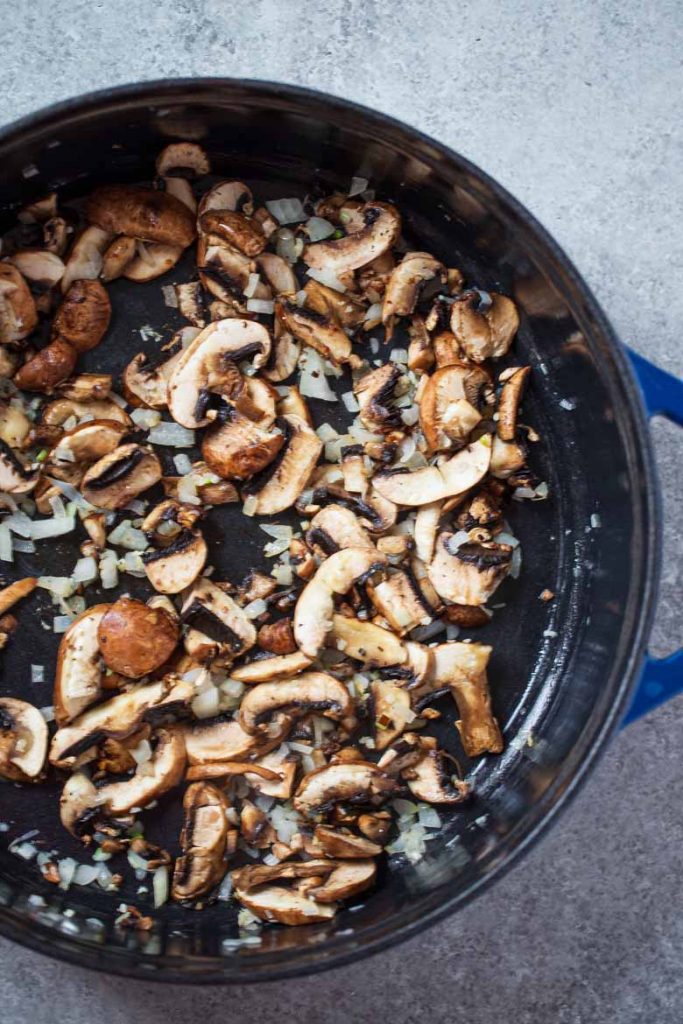 Sauteed garlic, onions and mushrooms in a pan with butter