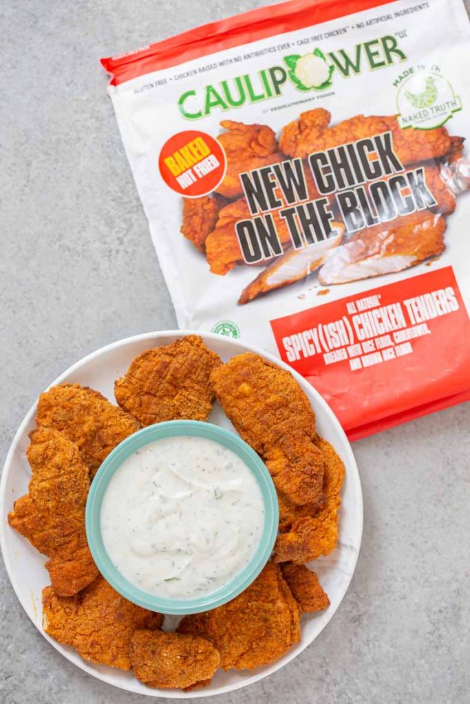 These Baked Chicken Tenders with Healthy Ranch Dipping Sauce are a quick and easy weeknight dinner the whole family will enjoy!