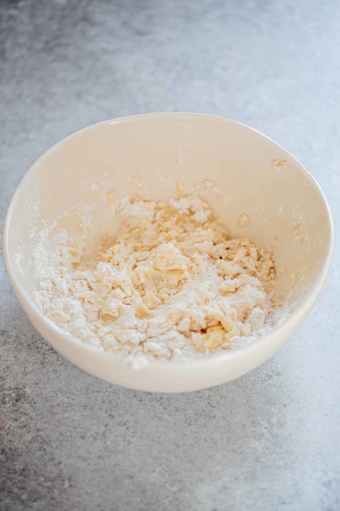 Homemade pizza dough ingredients mixed in a bowl
