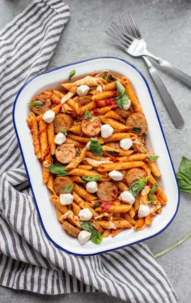 Pasta dish full of One Pot Chicken Sausage Caprese Pasta