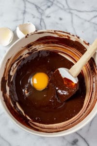 Add egg to melted chocolate mixture