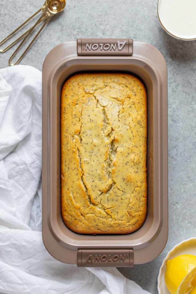 baked lemon poppy seed loaf bread out of the oven.