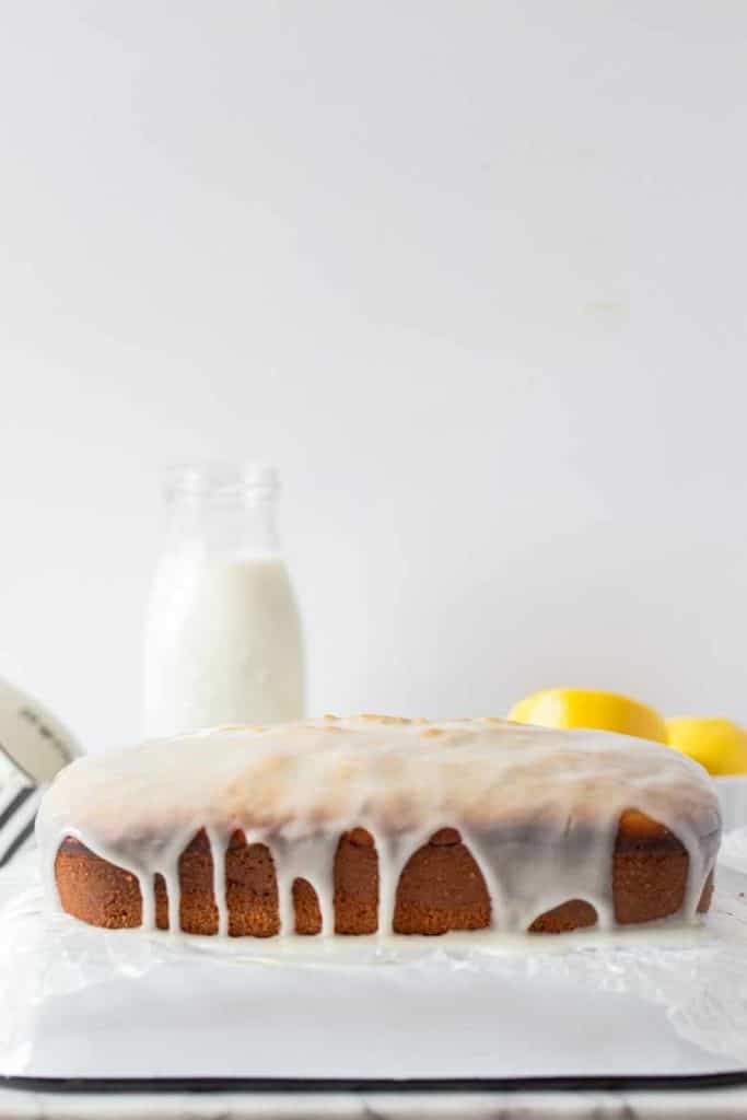 Lemon Poppy Seed Loaf with lemon glaze drizzled all over the top.