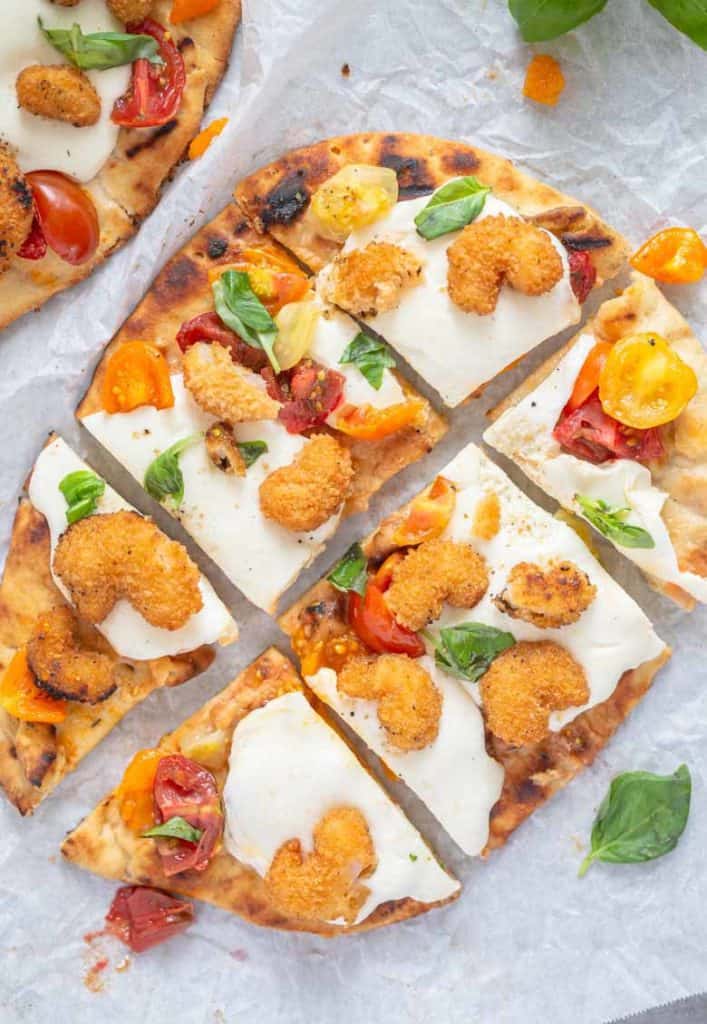 Popcorn Shrimp Margherita pizza sliced into pieces