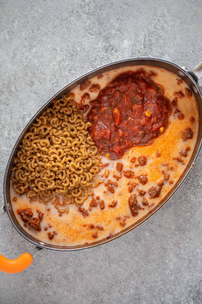 macaroni pasta, salsa, almondmilk, taco seasoning and water added to browned Chorizo Seasonings Turkey Sausage in pan
