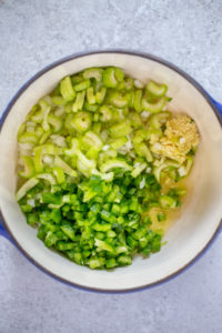 saute green bell pepper, onion, celery and garlic in sauce pot with olive oil.